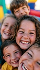 Obraz premium Group of children laughing together inside inflatable castle