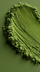 matcha powder brush stroke on vibrant green background, abstract matcha powder smear with green textured backdrop, organic matcha tea powder brushstroke over minimalist green background © overrust