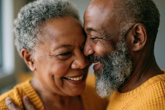 Senior couple sharing joyful close moment at home