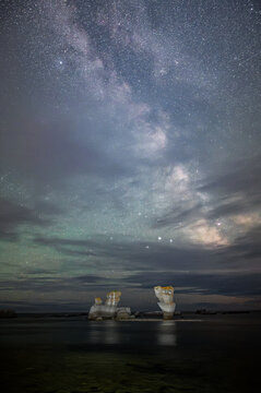 Mingan Archipelago national park's majestic monoliths at night, natural wonders on Quarry island, Milky way birghtening the scene, C&ocirc;te-Nord, Quebec, Canada