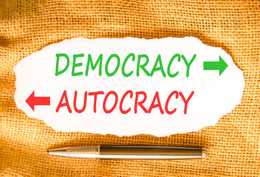 Democracy or autocracy words symbol. Concept words Democracy Autocracy on beautiful white paper. Beautiful canvas background. Business democracy autocracy concept. Copy space