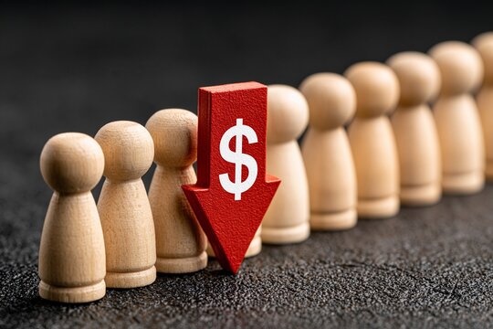 Red downward arrow with dollar symbol stands before wooden figures in row