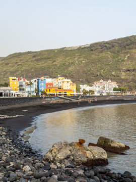 Colourful houses at the black sand beach of Puerto de Tazacorte on La Palma, Canary Islands, Spain.