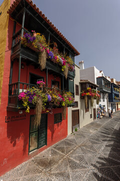 The Balcones de la Avenida Maritima, town houses with wooden balconies decorated with colourful flowers in Santa Cruz de La Palma, the capital of La Palma, Canary Islands, Spain.