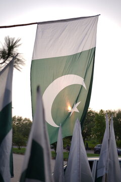 Pakistan Independence Day flag decoration on roadside stall outdoor scene