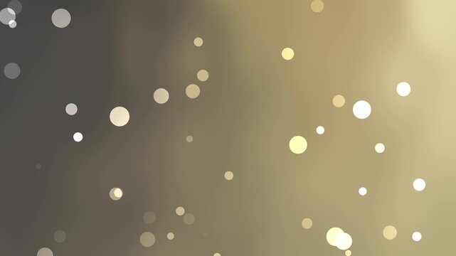 Blurred bokeh light circles golden brown gradient background as an artistic abstract soft texture suitable for website design.