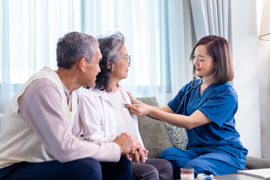 Senior couple get medical service visit from caregiver nurse at home while having medical checkup on heart and cardiovascular system for health care and pension welfare insurance