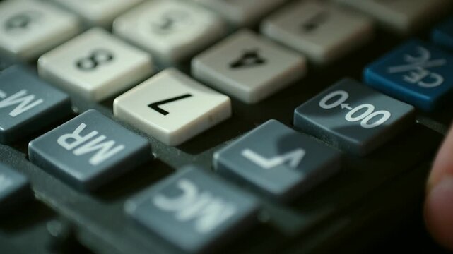 Close up finger pressing buttons on old calculator, performing mathematical operations for accounting, tax calculation, managing business finances in office environment. Person using calculator.