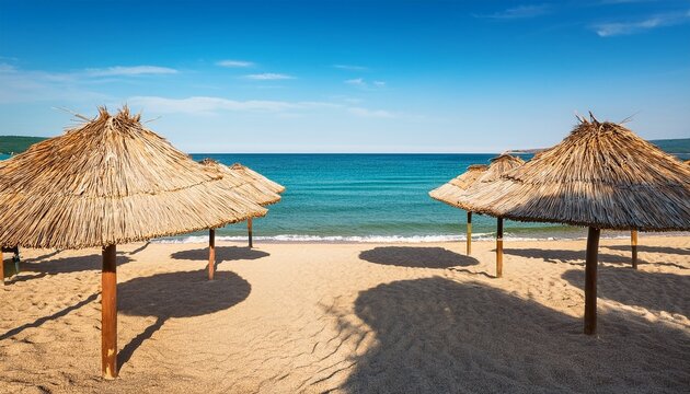 thatched umbrellas on sandy beach leading to sea in sveti vlas bulgaria