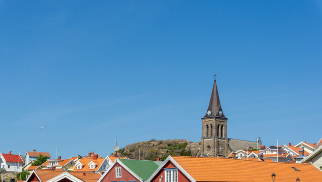Fj&auml;llbacka village church and rooftops under clear sky
