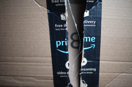 Amazon prime package damaged box, copy space bokeh background image, shipping issues theme