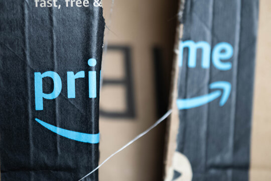 Amazon prime package damaged box, copy space bokeh background image, shipping issues theme