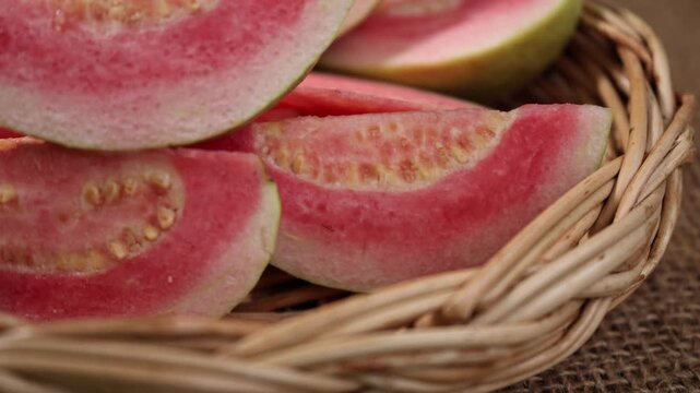 Fresh red-fleshed guavas in a basket