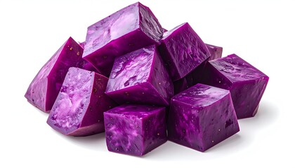Fototapeta premium A pile of fresh raw purple sweet potato ube cubes displaying rich vibrant violet colors on a white background