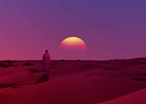 Silhouette view of muslim man or arab man walking on desert sand at sunset - Sahara Desert