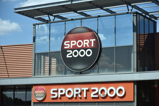 Montlu&ccedil;on - France - 2 August 2026 - Sports 2000 store sign displayed on the facade of a retail shop in France. Exterior view of the well-known sporting goods retailer. Editorial use only.
