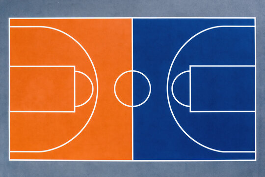 Basketball court top view with orange and blue halves, white lines marking key areas, clean outdoor surface, vibrant colors, symmetrical design, sports field for game play