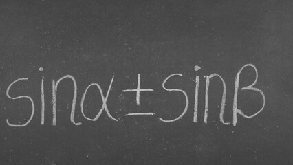 Sum and difference of sines - trigonometric formula on the blackboard © Predrag