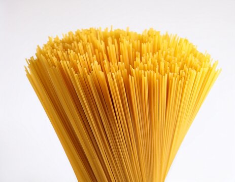 a bunch yellow spaghetti pasta un cook white background