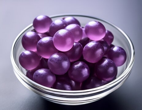 grape purple jelly gum candy fruity vitamin healthy snack food on glass bowl