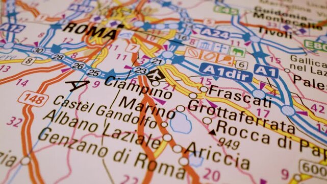 road network to rome, italy, gliding macro view over atlas map