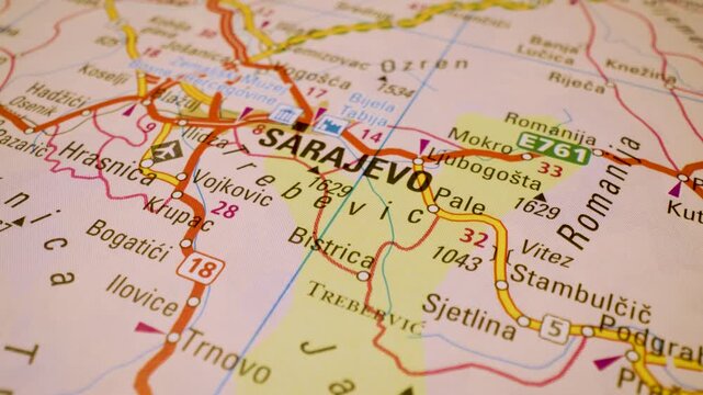 road network to sarajevo, bosnia and herzegovina, gliding macro view over atlas map