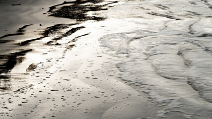 Abstract wet sand texture with natural patterns © The Long Horizon