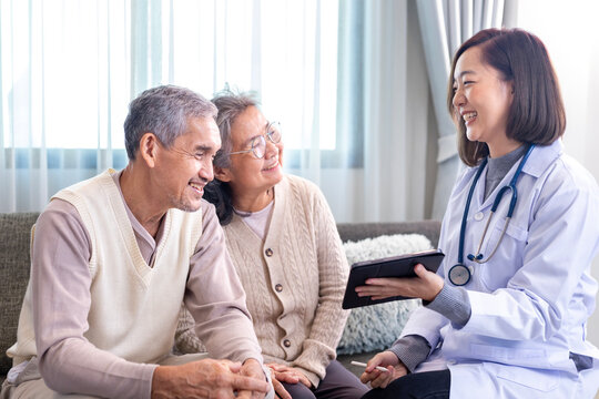 Senior couple got medical service visit from caregiver doctor at home while having result of medical exam for health care and pension welfare insurance