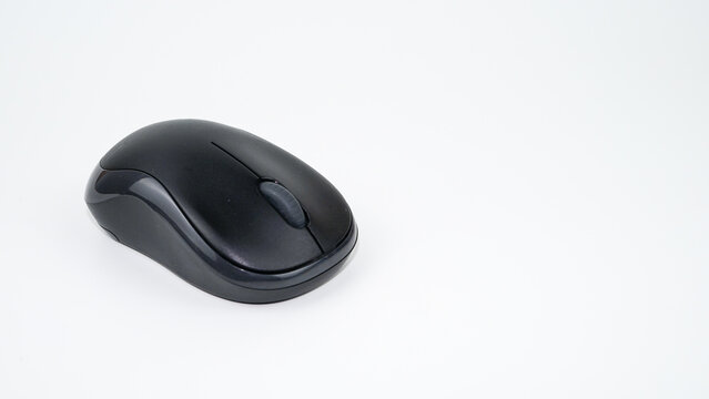 Black wireless computer mouse on a white background
