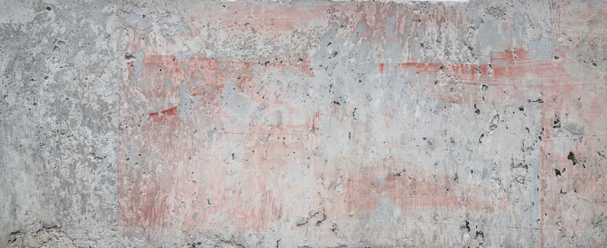  Weathered Concrete Wall Texture with Faded Red Paint Stains.
