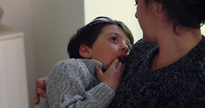 Young boy listens attentively as mother discusses his past behavior at home, teaching accountability, emotional awareness, respectful communication and positive choices