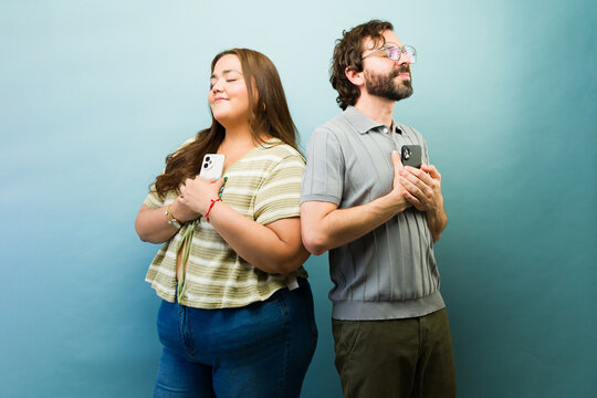 People showing deep connection and love for their smartphones, symbolizing digital attachment and dependence