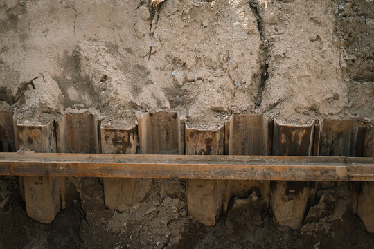 Steel sheet piling and metal retaining wall in excavation pit  