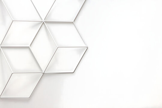 Minimalist white background with geometric wireframe cube pattern on the left and copy space