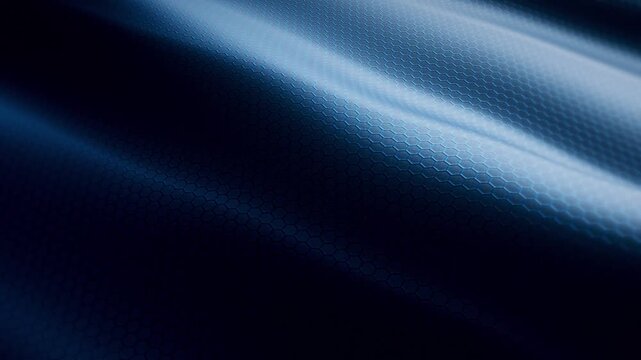 Widescreen loop of blue hexagonal embossed material with glowing light waves, futuristic technology and automotive interior texture background