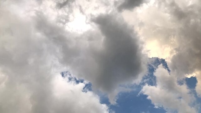Dramatic stormy sky with heavy dark rain clouds gathering before a sudden summer downpour