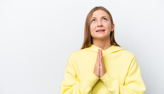 Young Russian woman isolated on white background keeps palm together. Person asks for something
