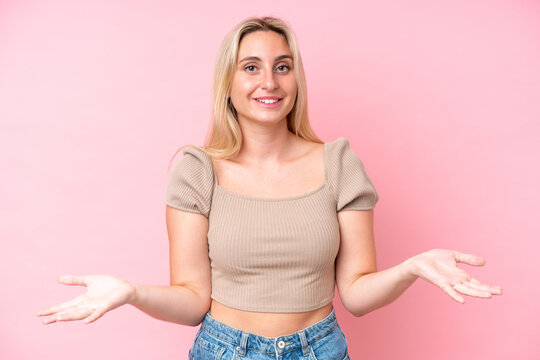 Young caucasian woman isolated on pink background happy and smiling