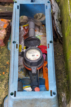 Residential Water Meter Installed Inside a Blue Protective Box