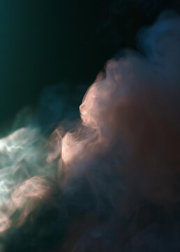 Abstract photograph of a cloud of smoke. the smoke is in various shades of blue, pink, and white, creating a soft and dreamy effect. the background is dark, making the smoke stand out even more.