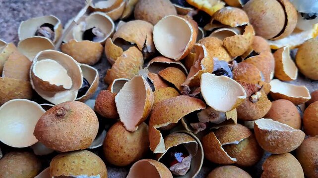 Pile of Broken Longan Fruit Shells with Natural Brown Texture