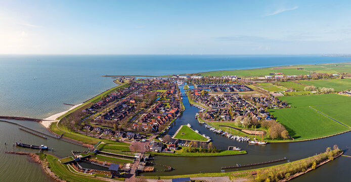 Overview of a historic lakeside town with waterfront in Europe