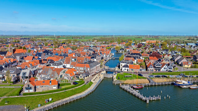 Aerial view of the historical town Makkum within a rural landscape in Friesland Netherlands