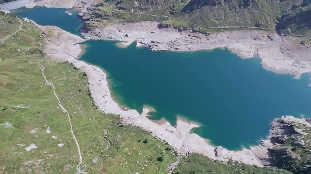 Climate crisis, the Twin lakes in the Orobie mountains in the middle of a drought, Lombardy landscape drone point of view