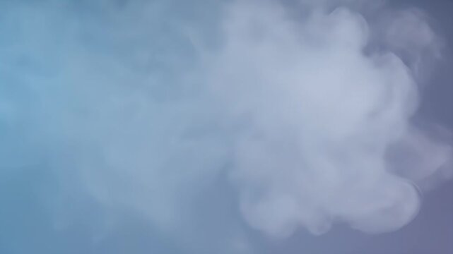 Single white fluffy cloud in blue sky.