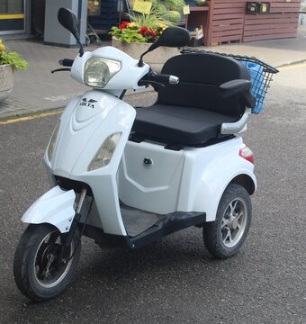Kohtla-Jarve Estonia 08 02 2026 White Electric Three-Wheeled Mobility Scooter Parked
