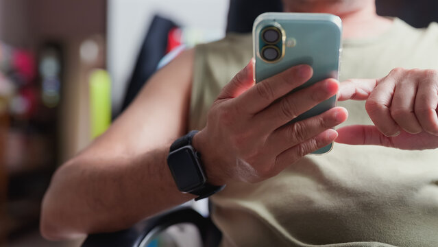 Adult holding smartphone device typing screen app digital network communication mobility interface interaction social media tech hardware gadget display user tap swipe message text web data service.