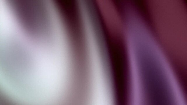 Elegant burgundy silk fabric background with soft and graceful light folds