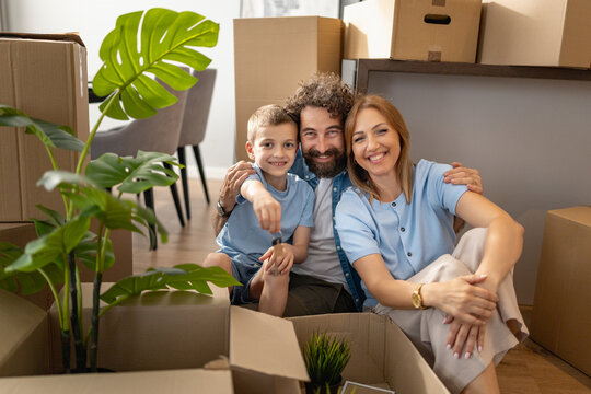 Family enjoys time together while unpacking in new home