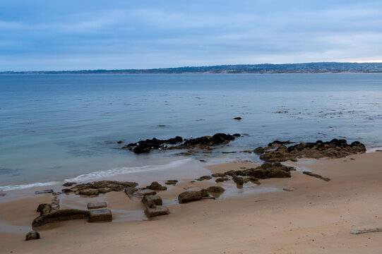 Coastline with rocks and calm water in the evening, Monterey County, California, USA